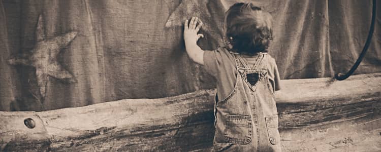 A boy leaning on the Wall